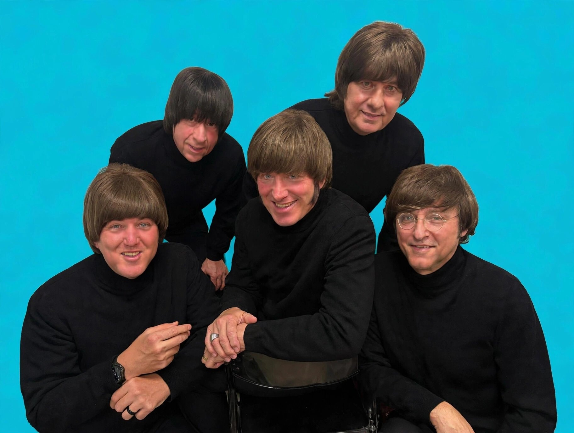 The Fab 5 in black turtlenecks against turquoise background
